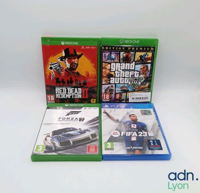 two xbox games are sitting on a white surface next to each other