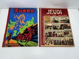 two comics are sitting on a table next to each other