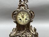 a small clock that is sitting on a table