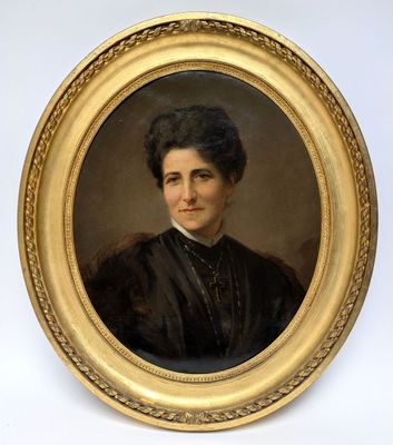 portrait of a woman in a black dress in a gold frame