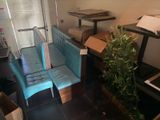 a couch and a table in a room with boxes on the floor