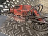 an image of a drill on a metal floor