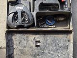 a tool box with tools inside of it on the floor