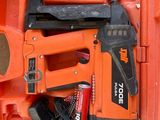 an orange tool case with tools in it on a table