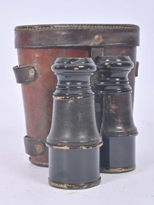 two binoculars sitting next to each other on a white surface
