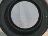 a close up of a tire on a counter with a wall in the background