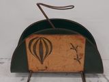 a small wooden box with a design on it