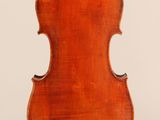 an old violin with a wooden back and a long neck