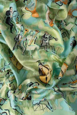 un gros plan sur un tissu vert orné d'un motif représentant des chats
