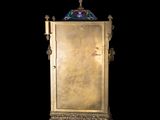 an image of a gold cabinet with a clock on top of it