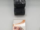 a close up of a pair of black hair ties on a white surface