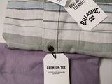 a tag on a shirt that is on a bed
