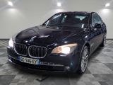 a picture of a black bmw parked in a garage