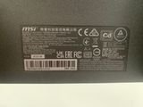 the back side of a laptop with a label on it
