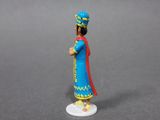 a small figurine of a man in a blue outfit