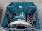 a blue tool box with a circular saw in it