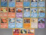 beaucoup de cartes pokemon sur le mur