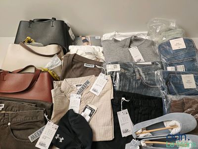 a pile of clothes and bags on the floor