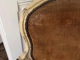 an old chair that has been cleaned and is sitting on the floor