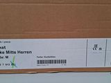a cardboard box with a label on it that says jacke mitte hen grade m