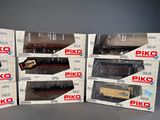 six boxed boxes of piko model trains sitting on a table
