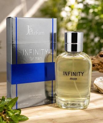 a bottle of perfume sitting on top of a table next to a box