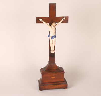 an antique wooden crucifix with a cross on top of it