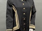 an image of a mannequin wearing a black and gold jacket