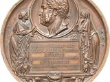 plaque en bronze représentant un homme et une femme, accompagnée d'une plaque représentant un homme et une femme