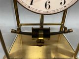 a clock that is sitting on top of a stand