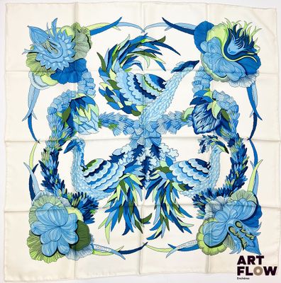 une image représentant un motif floral bleu et vert sur fond blanc