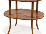 a small wooden table with two shelves on it