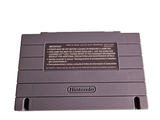 a nintendo game console sitting on top of a white surface