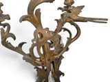 a gold colored candle holder with birds on it