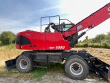 a red crane that is sitting on the back of a truck