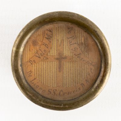 a close up of a clock on a white surface