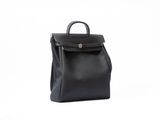 a black leather backpack on a white background