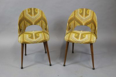 pair of mid century style chairs with upholstered upholstered seats