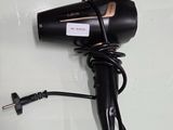 a hair dryer that is sitting on top of a table
