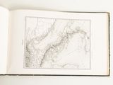 an open book with a drawing of a map on it