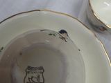 a cup and saucer sitting on a table
