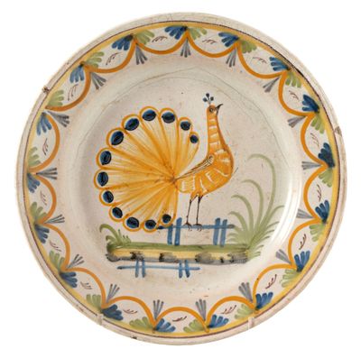 a plate with a bird painted on it