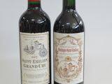 two bottles of wine sitting next to each other on a table
