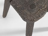 a small wooden table with a flower on top of it