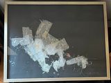a picture of a black and white painting on a table