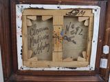 a picture of a wooden frame with writing on it