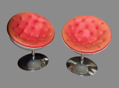 two chairs that are sitting on top of each other