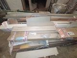 a lot of boxes and boxes of wood on the floor