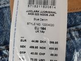 the label on the back of a pair of jeans is attached to the back of a pair of jeans
