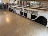 a long counter with a bunch of dishes on it
